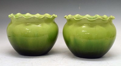 Lot 721 - Pair of 19th Century pale green frilled earthenware planters