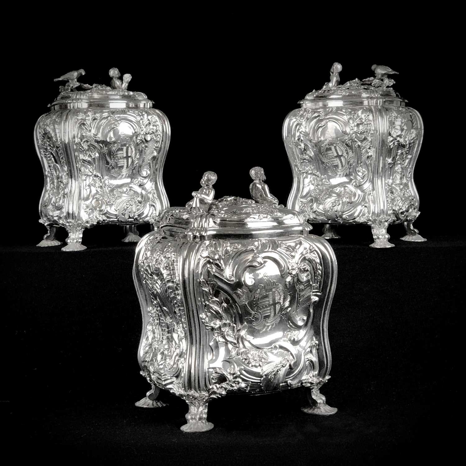 Lot 71 - Set of George II silver tea canisters and sugar box in fitted ebonised case