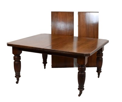 Lot 471 - Late Victorian/Edwardian walnut dining table with two leaves