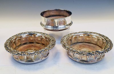 Lot 176 - Elizabeth II silver bottle coaster together with a pair of plated wine coasters