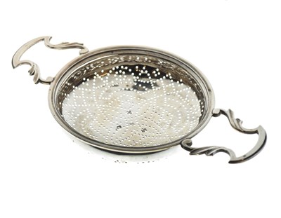 Lot 70 - George III twin handled lemon strainer