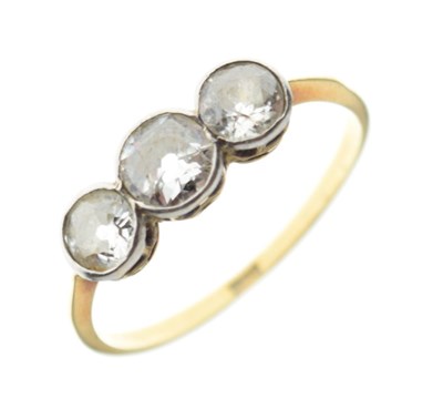 Lot 4 - Yellow metal ring stamped '18ct', set three old-cut diamonds