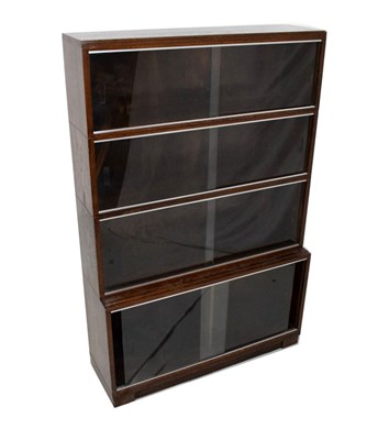 Lot 512 - Oak four-section bookcase with sliding glass doors