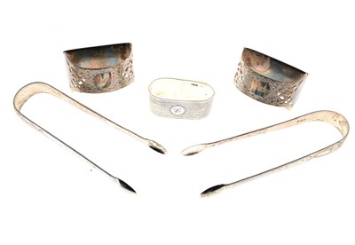 Lot 181 - Pair of late Victorian napkins rings, together with sugar tongs & single napkin ring