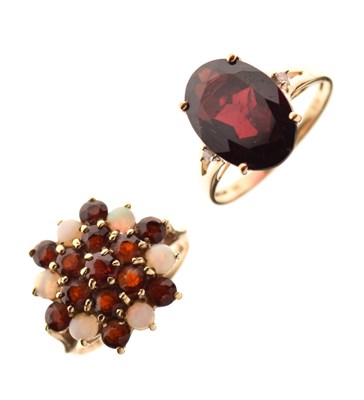 Lot 27 - 9ct gold garnet and opal dress ring, size M½, and another garnet dress ring