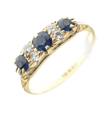 Lot 1 - Yellow metal (18ct) seven-stone sapphire and diamond ring, 2.9g gross approx