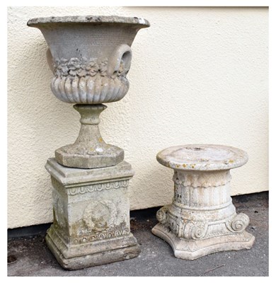 Lot 657 - Composite stone garden urn on pedestal base, together with a column top