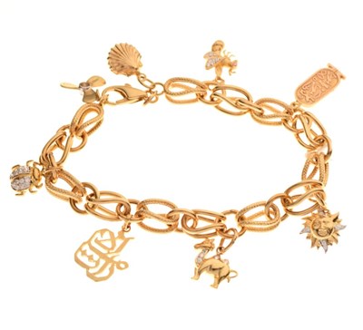 Lot 33 - Yellow metal 14k charm bracelet