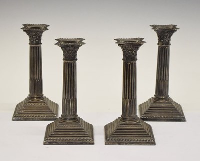 Lot 84 - Set of four Edward VII Corinthian column silver candlesticks