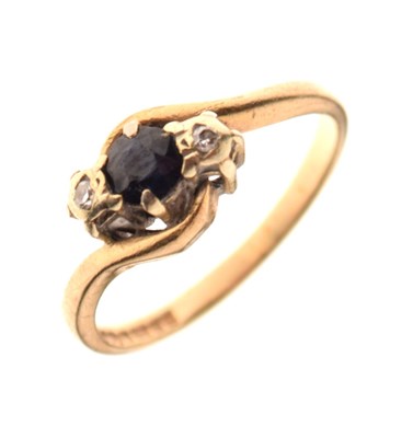 Lot 9 - 9ct gold, sapphire and diamond three-stone crossover ring