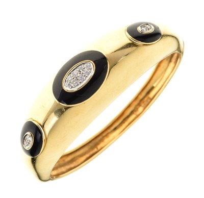 Lot 31 - 18ct gold, diamond and black enamel hinged bangle