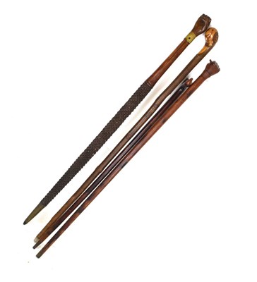 Lot 206 - Four various walking sticks - Dog's head, two clasped hands, etc (4)