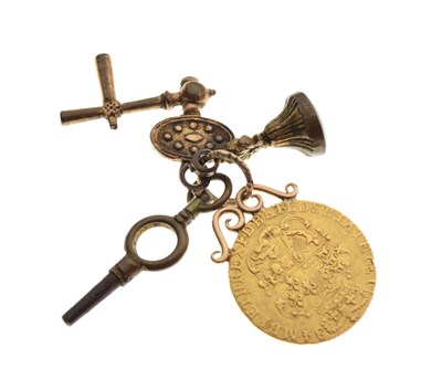 Lot 54 - George III guinea on scroll mount with sundry watch winders and fob