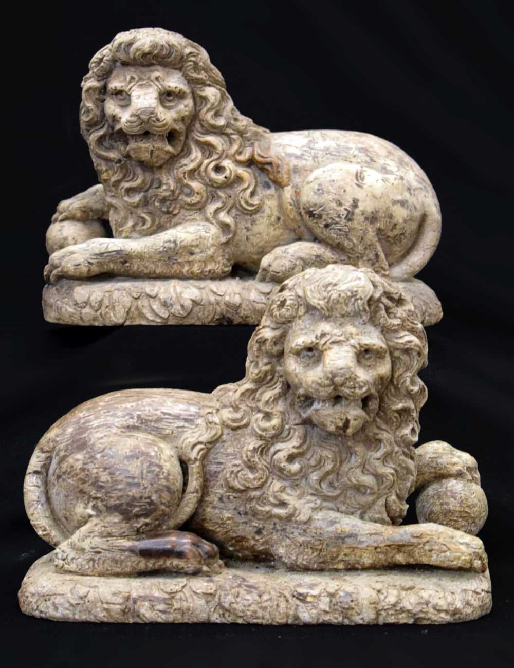 Lot 172 - Rare pair of late 16th or early 17th Century carved limewood recumbent lions