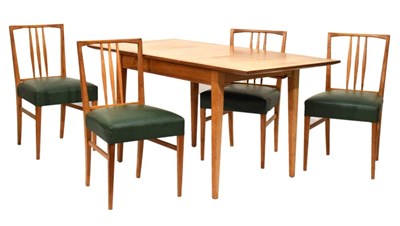 Lot 658 - Gordon Russell table and four chairs