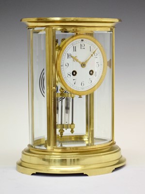 Lot 455 - Late 19th Century French lacquered brass oval four-glass mantel clock - Vincenti