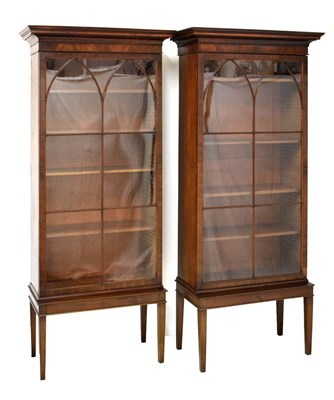 Lot 454 - Pair of early 19th Century glazed mahogany bookcase sections on later stands