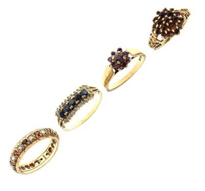 Lot 20 - Three 9ct gold garnet set dress rings a 14ct dress ring set white and blue stones