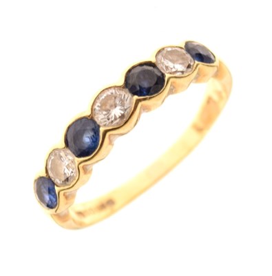 Lot 29 - 18ct gold half hoop ring, set with four sapphire and three brilliant cut diamonds