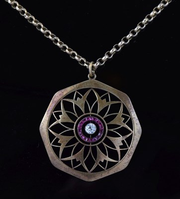 Lot 29 - Diamond and calibre ruby pendant