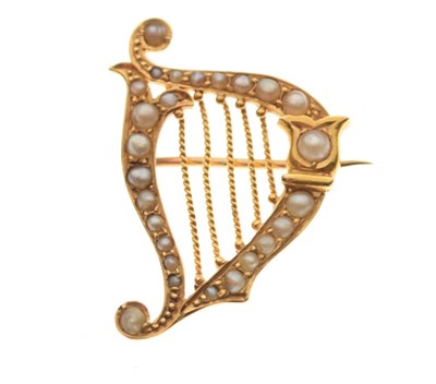 Lot 25 - Yellow metal seed pearl harp brooch