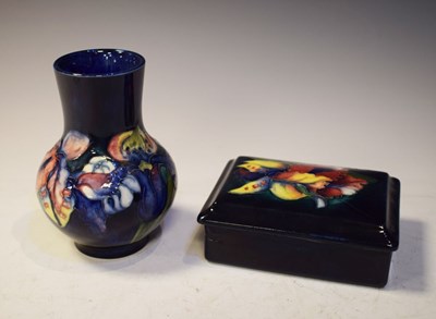 Lot 383 - Moorcroft pottery 'Orchid' pattern bulbous vase and lidded box