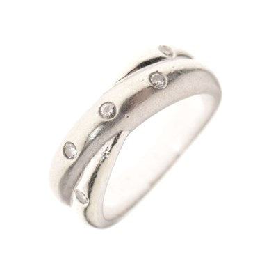 Lot 4 - 9ct white gold diamond set crossover-style wedding band