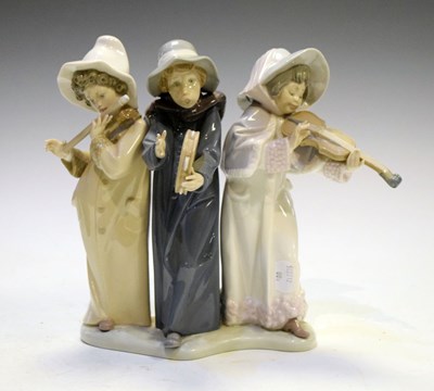 Lot 321 - Lladro - Porcelain figure group of three child musicians