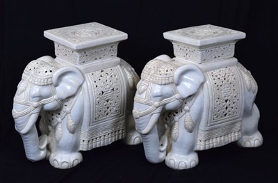 Lot 606 - Two white glazed elephant garden seats