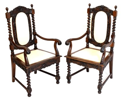 Lot 365 - Pair of reproduction chairs with carved decoration and padded backs