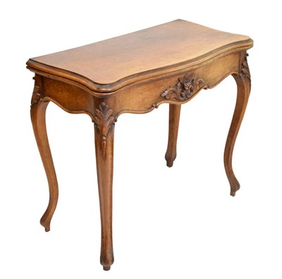 Lot 361 - Late 19th Century French walnut serpentine front fold over card table