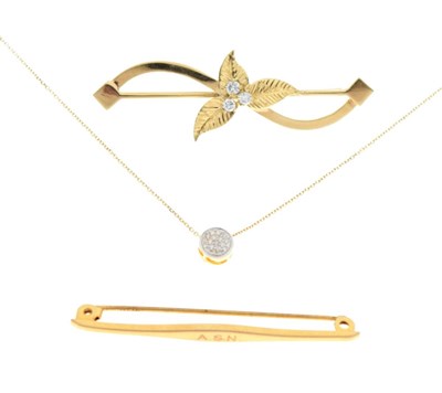 Lot 56 - 750 yellow metal and diamond bar brooch,, a 9ct brooch, and a 9ct pendant with chain
