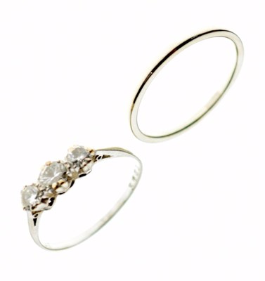 Lot 28 - 18ct white gold wedding band, and a three-stone diamond ring stamped 'Plat'