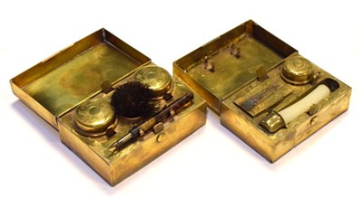 Lot 186 - Two Victorian rectangular gilt metal travelling inkwells/desk stands
