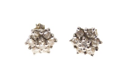 Lot 29 - Pair of seven-stone diamond cluster ear studs