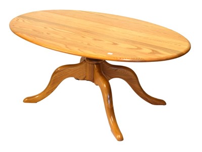 Lot 728 - Ercol Golden Dawn coffee table on quatrefoil base