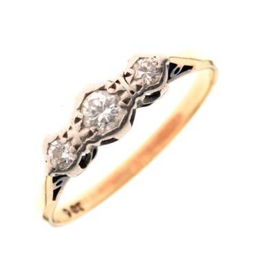 Lot 15 - Yellow metal and three-stone diamond ring