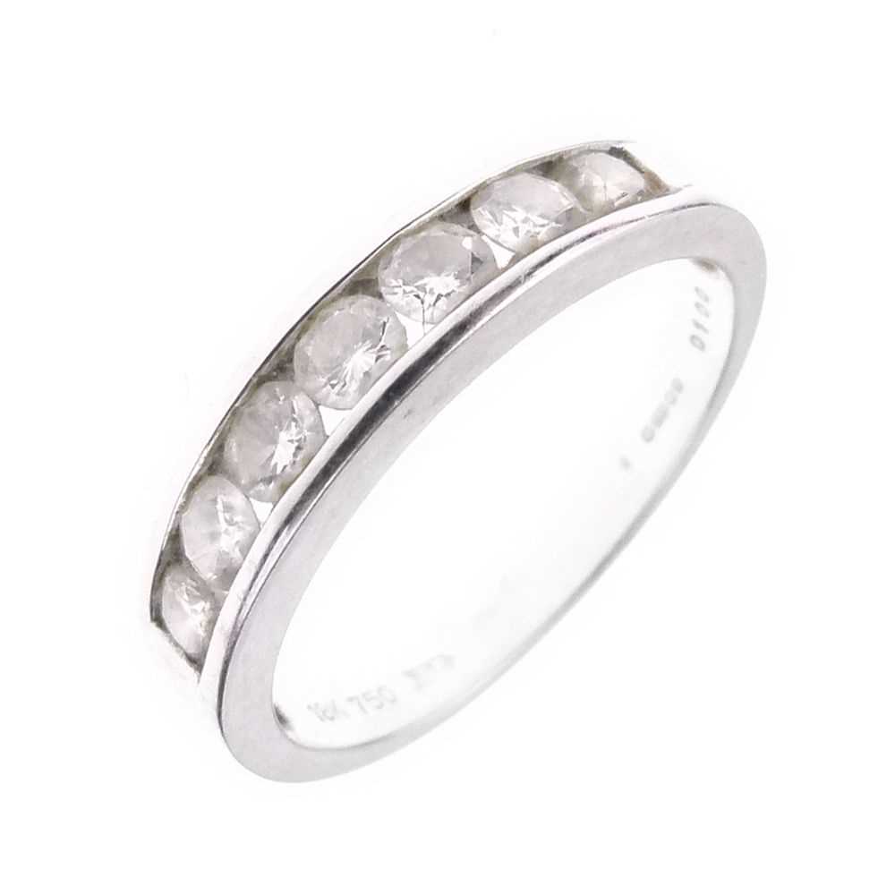 Lot 11 - Seven-stone diamond half hoop ring