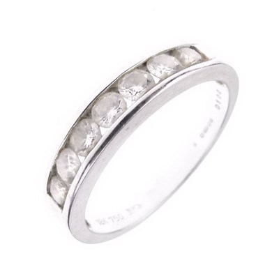 Lot 11 - Seven-stone diamond half hoop ring
