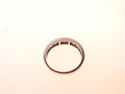 Lot 11 - Seven-stone diamond half hoop ring