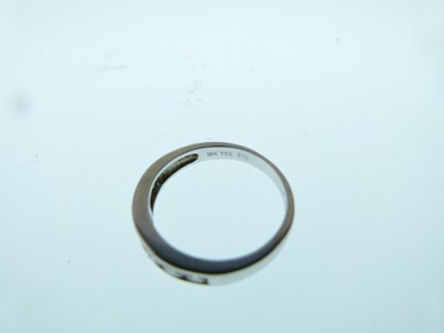 Lot 11 - Seven-stone diamond half hoop ring