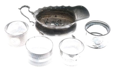 Lot 134 - Edward VII silver sauce boat and four assorted napkin rings