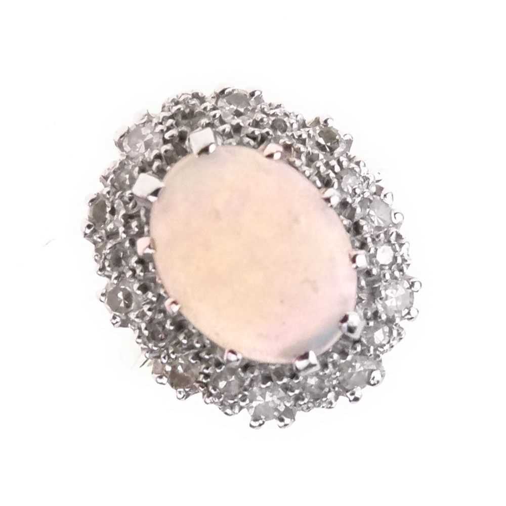 Lot 26 - Opal and diamond 18ct gold cluster ring