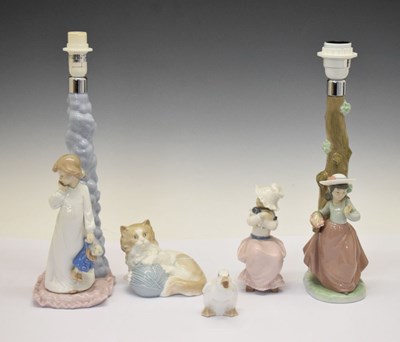 Lot 437 - Two Nao lamps and a quantity of Nao figures