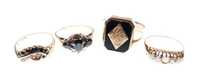 Lot 44 - Four yellow metal rings