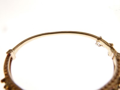 Lot 32 - 9ct gold garnet and cultured pearl hinged bangle