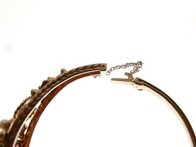 Lot 32 - 9ct gold garnet and cultured pearl hinged bangle