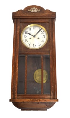 Lot 484 - 1920s oak wall clock