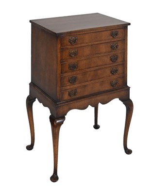 Lot 691 - 1920s period walnut chest on stand