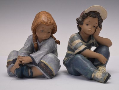 Lot 424 - Two Lladro gres figures, a boy and a girl numbered 2209 and 2210